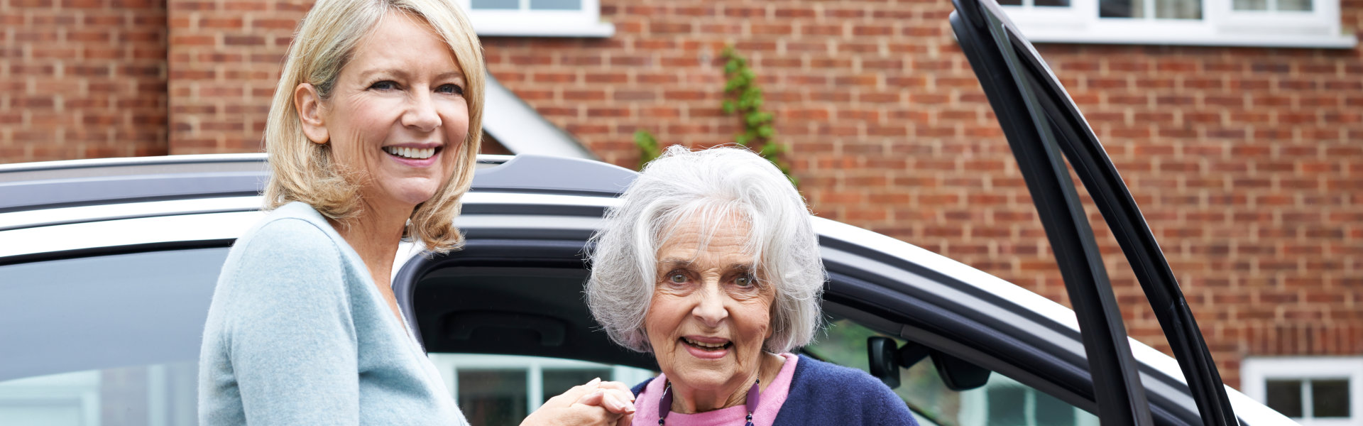 woman and her patient getting out of the car